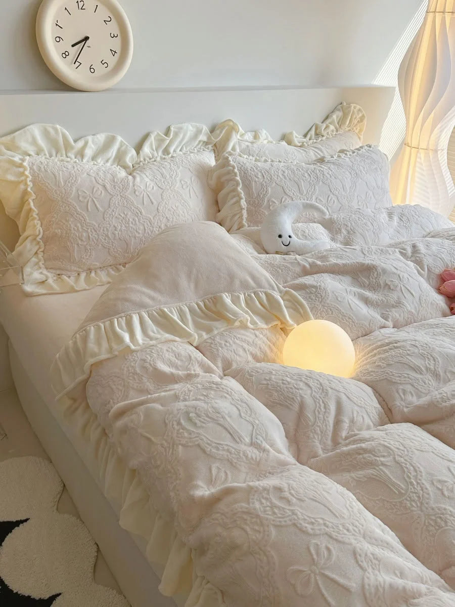 Creamy Beige Plush Ruffled Flannel Fleece Bedding Set on a bed with a moon plushie and orb light, styled in a Coquette aesthetic bedroom - RoomDen.