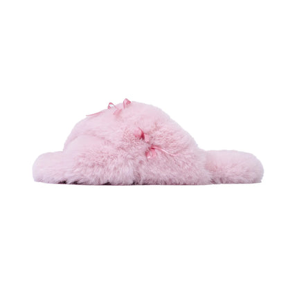 Side profile of soft pink plush slipper with satin bow - RoomDen