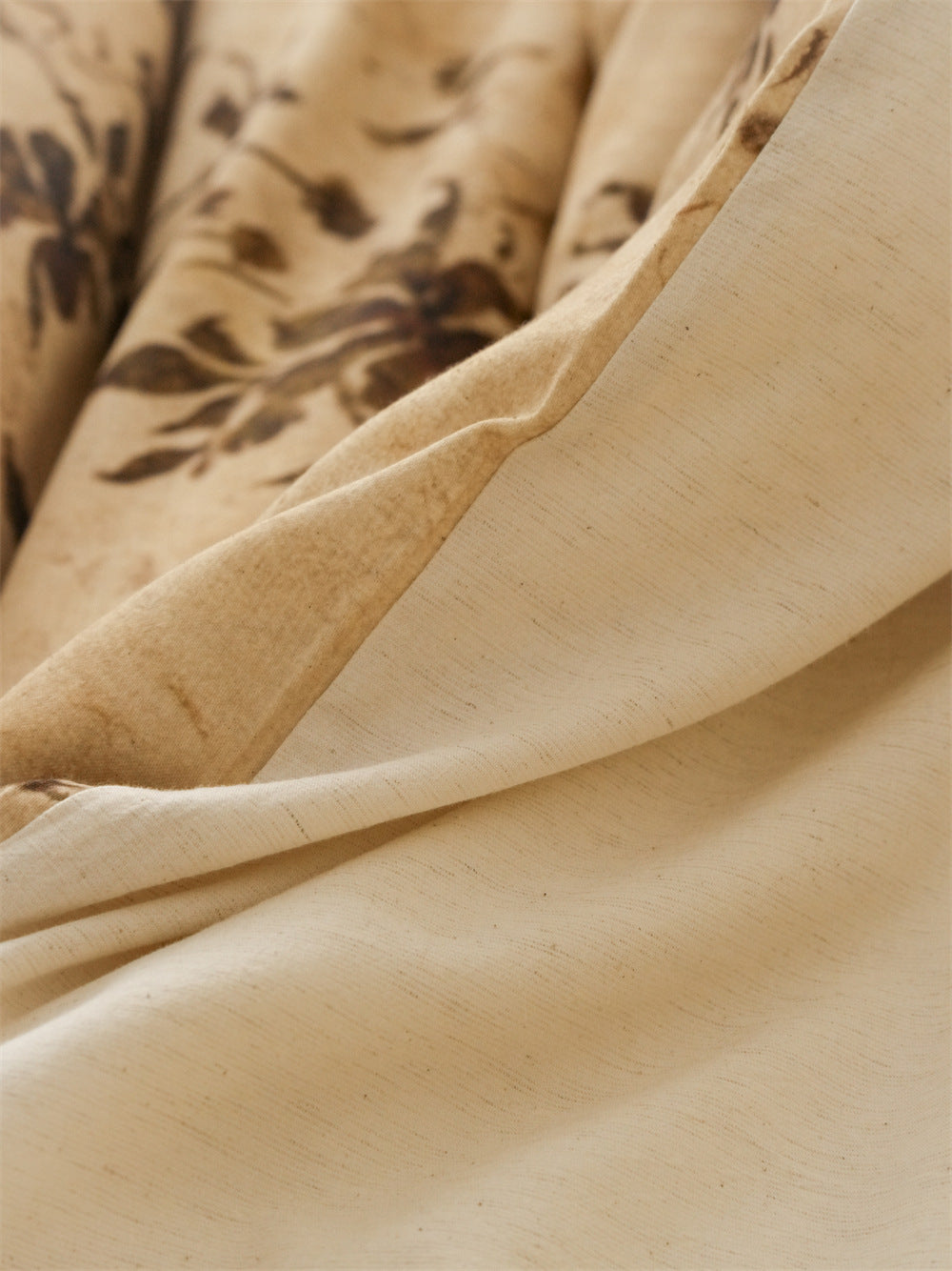 Stillgarden Ochre Branch Cotton Linen Bedding Set – Close-up of the plain pale reverse beside the ochre print - Roomden