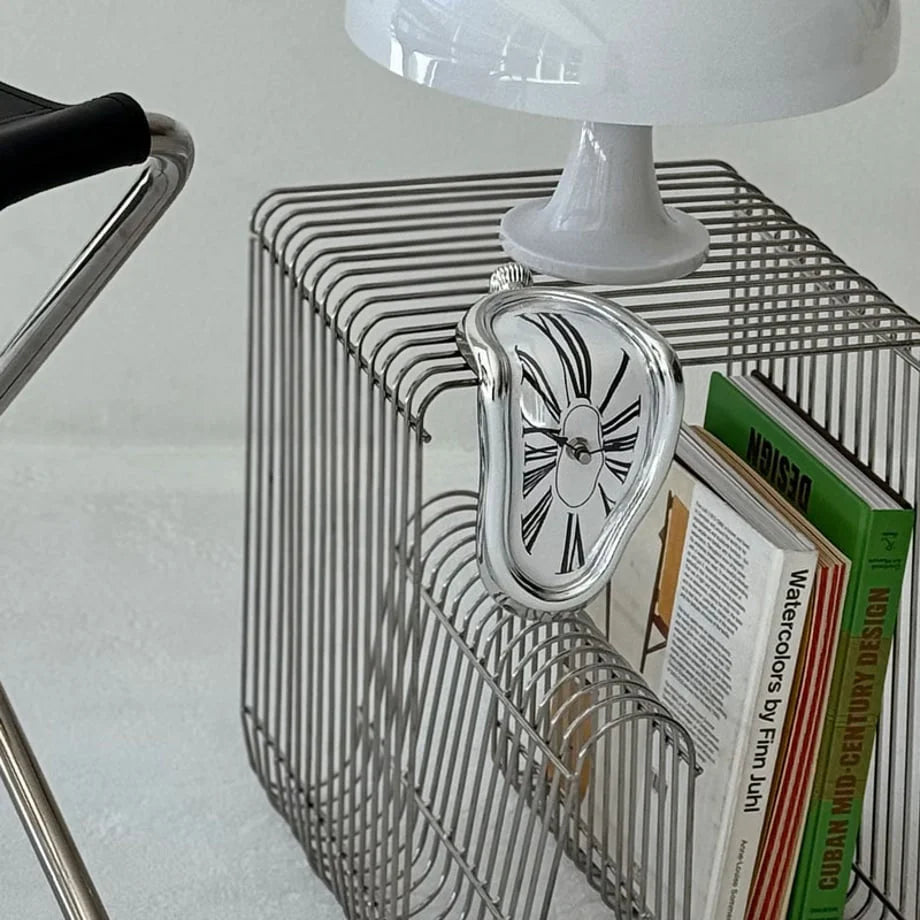 Closer view of the silver melting clock in a modern, industrial-style setting. - RoomDen