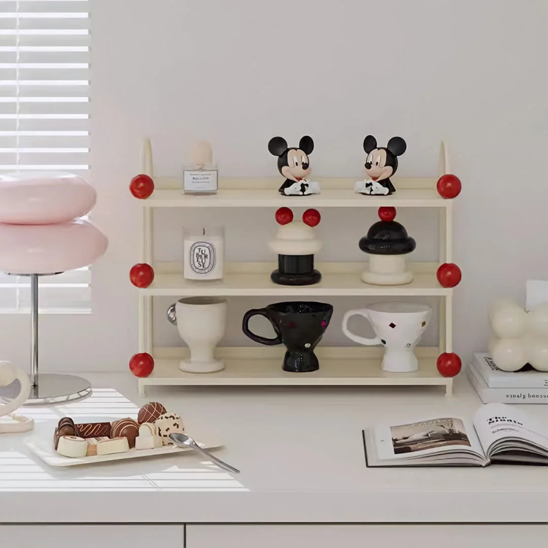 Playful Bauble Two-Tone Metal Desk Shelf in Creamy White & Red displaying mugs and decor - RoomDen.