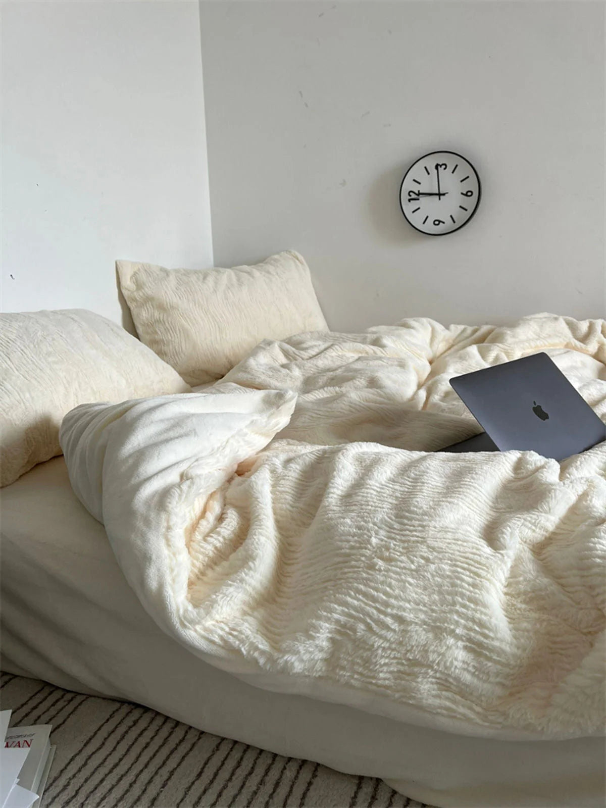 A beautifully lit shot of the Creamy White ruched fleece bedding, emphasizing its cozy and serene feel. - RoomDen