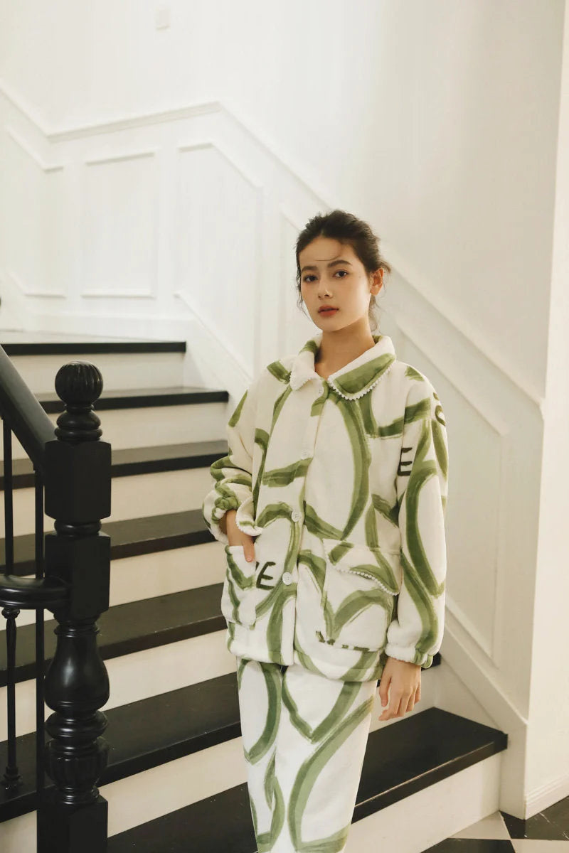 Full body shot of a model with hand in pocket of the Plush Graffiti Love Fleece Pajama Set - RoomDen.