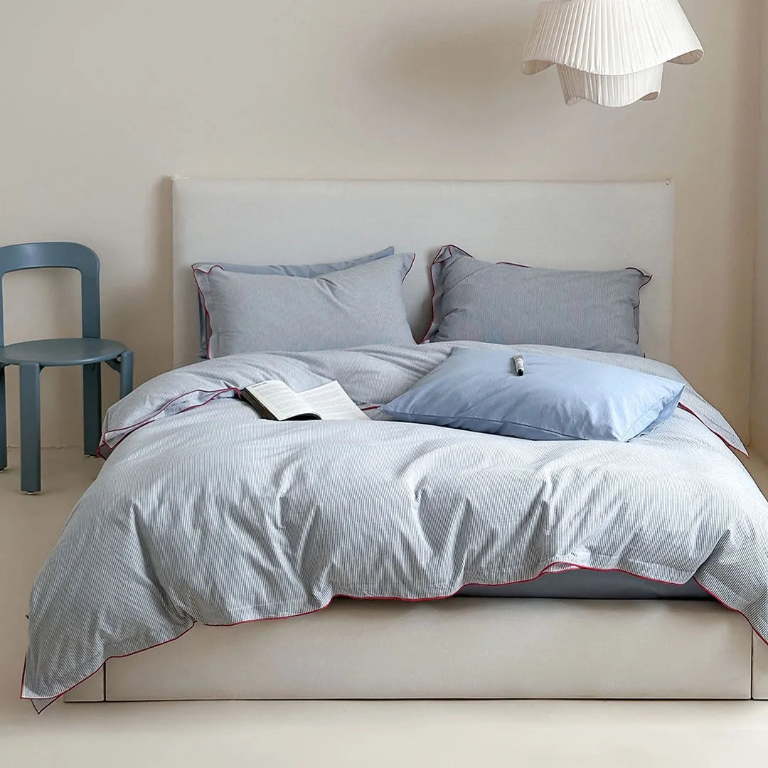 Full view of the Light Grey & Red Pinstripe Washed Cotton Bedding Set on a bed with a white headboard - RoomDen.