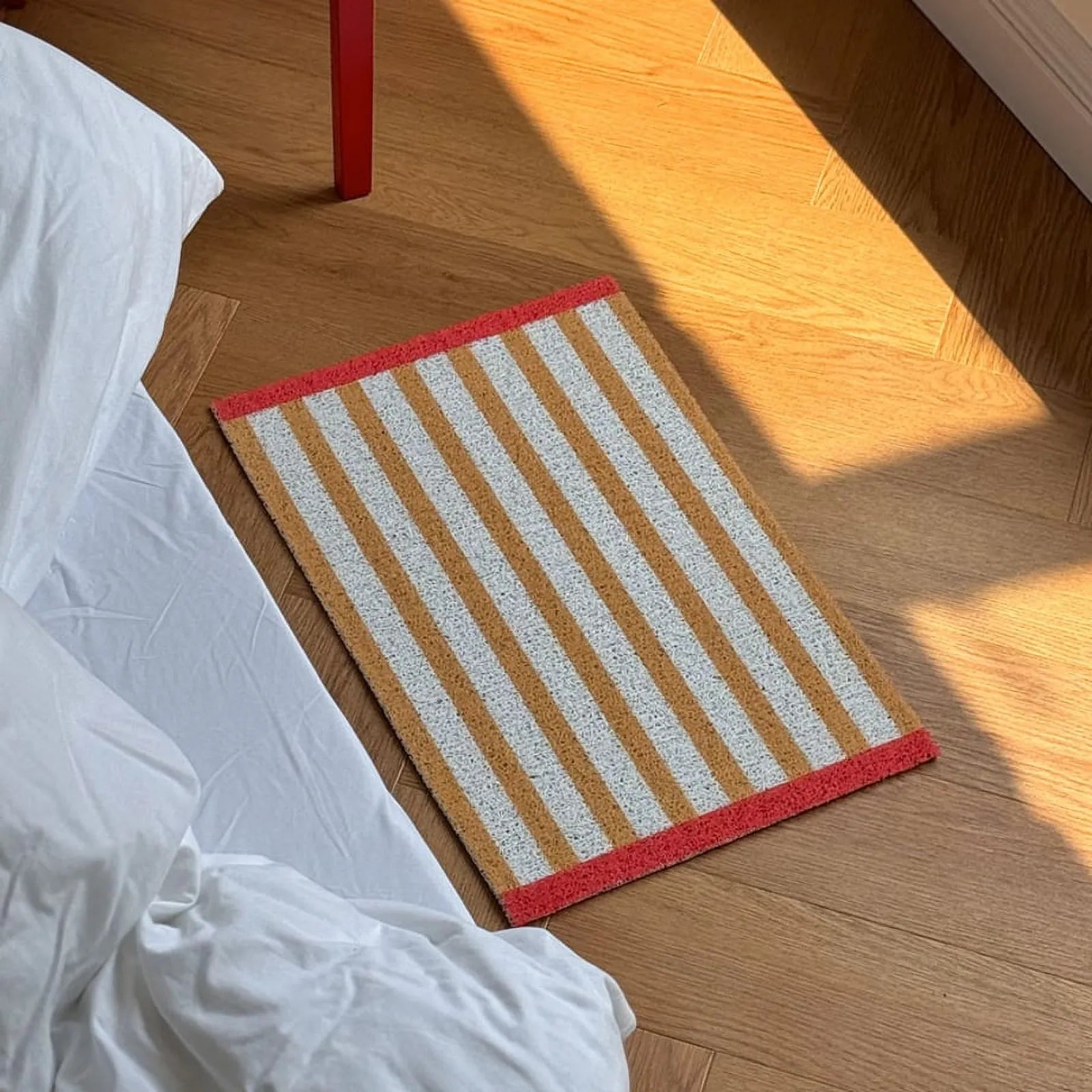 Sunlit view of Mustard Yellow Striped PVC Coil Rug - RoomDen