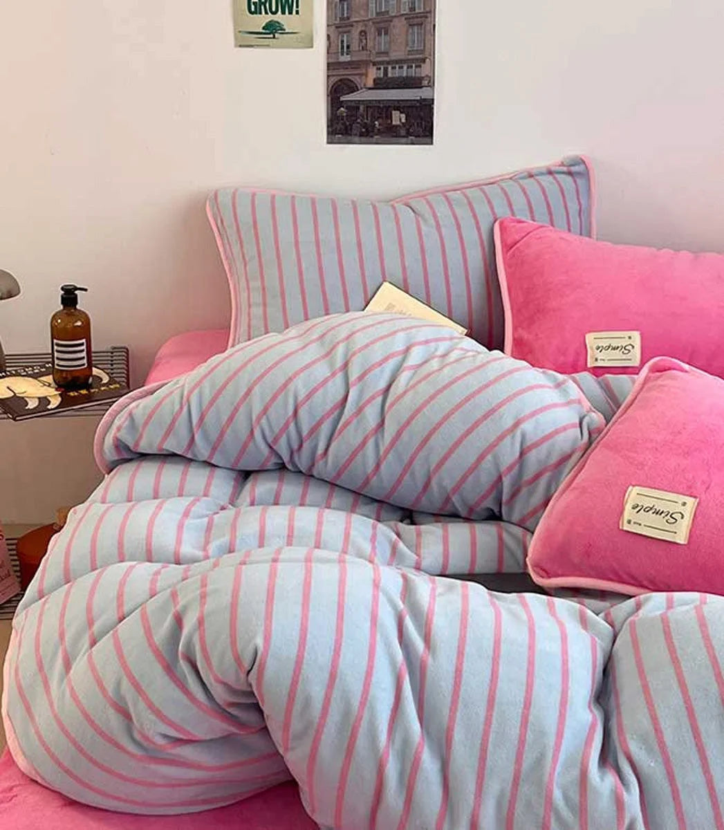 Styled bed showing the Bubblegum Pink Striped Flannel Fleece Bedding Set with matching pink pillows. - RoomDen