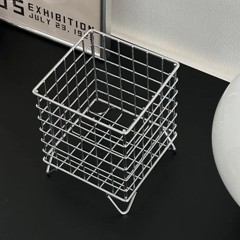Angled top view of the empty chrome wireframe desktop organizer, highlighting its construction - RoomDen.
