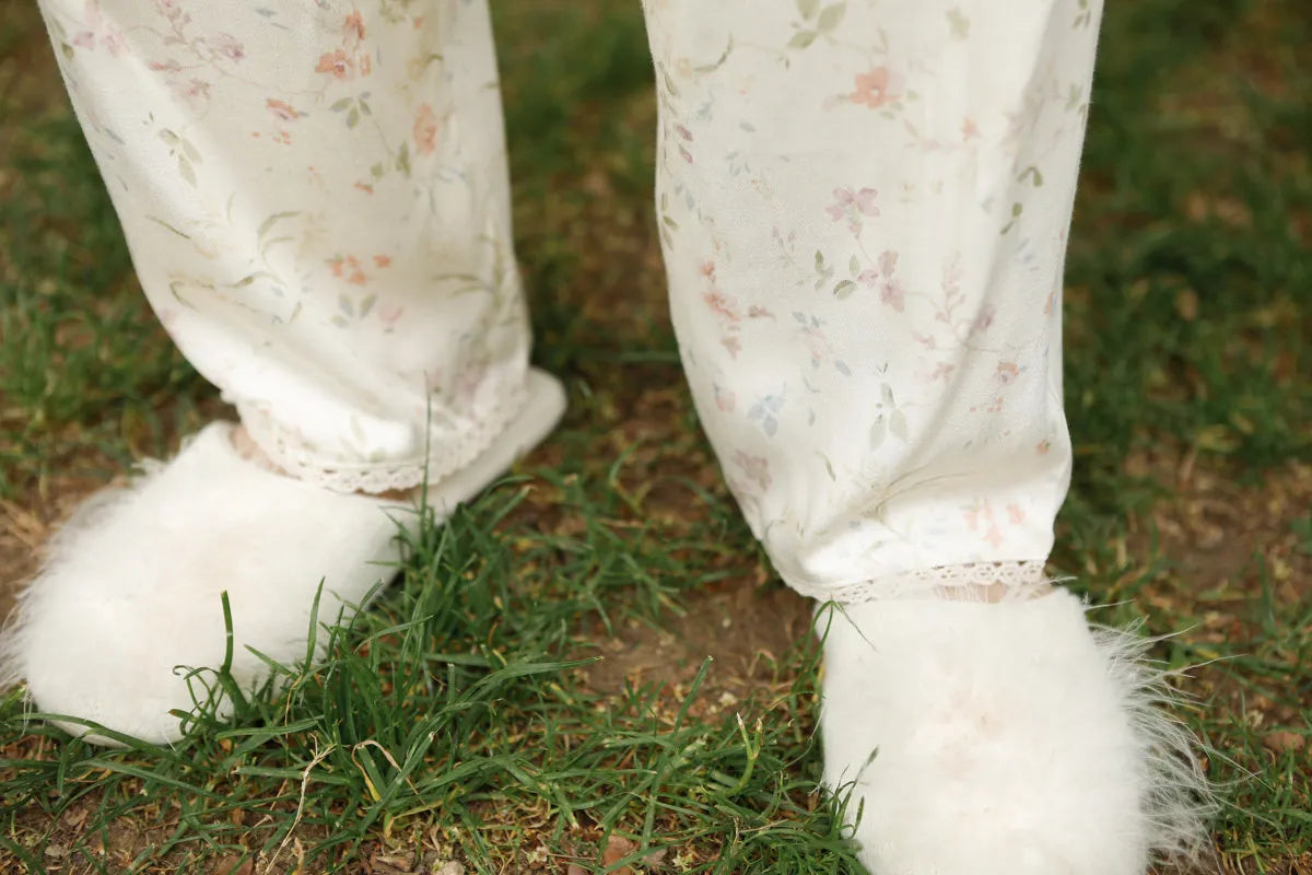 Detail Shot of Pant Hem with Lace Trim and Fuzzy Slippers - RoomDen