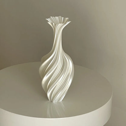 Pearl White Sculptural Swirl Ribbed PLA Vase on a white pedestal, full view - RoomDen