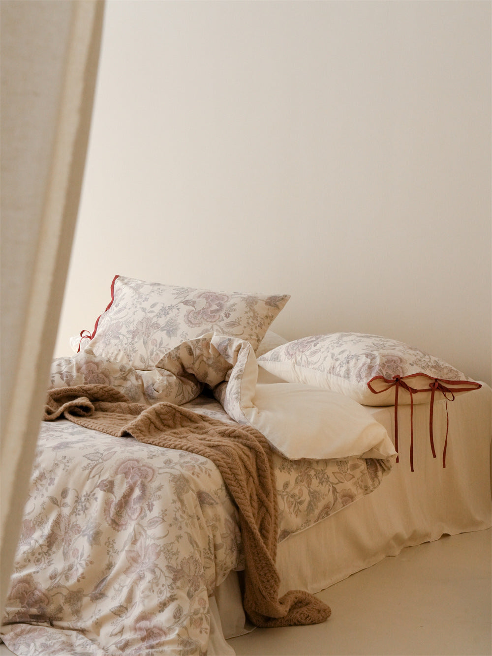 Stillgarden Mauve Flourish Cotton Linen Bedding Set – Angled bed view with pale reverse and floral pillows - Roomden