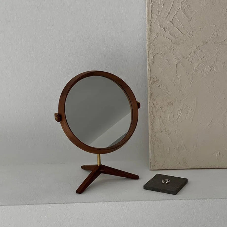 Natural Grain Round Walnut Wood Desktop Mirror on a white shelf. - RoomDen