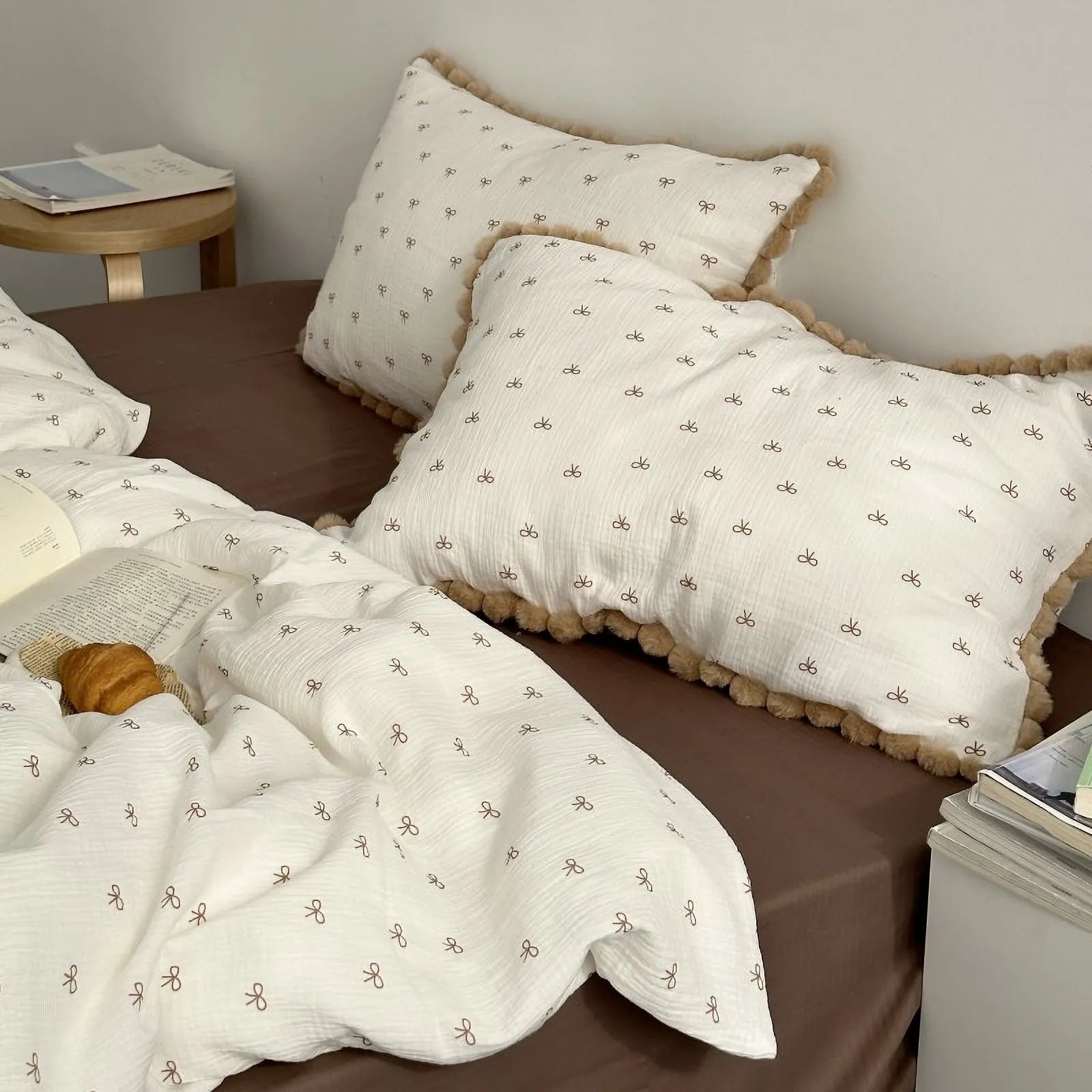 A wider bedroom view of the Pom Pom Trim Bow Print Bedding Set, showing the cozy and inviting atmosphere it creates. - RoomDen