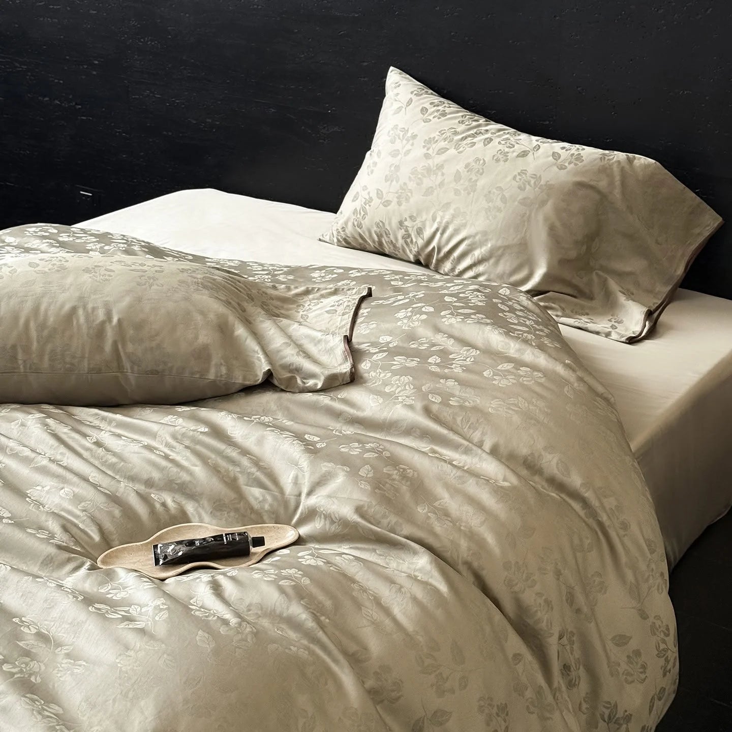 Lifestyle shot of the Khaki Green Tencel bedding set, showing its soft drape and inviting texture.