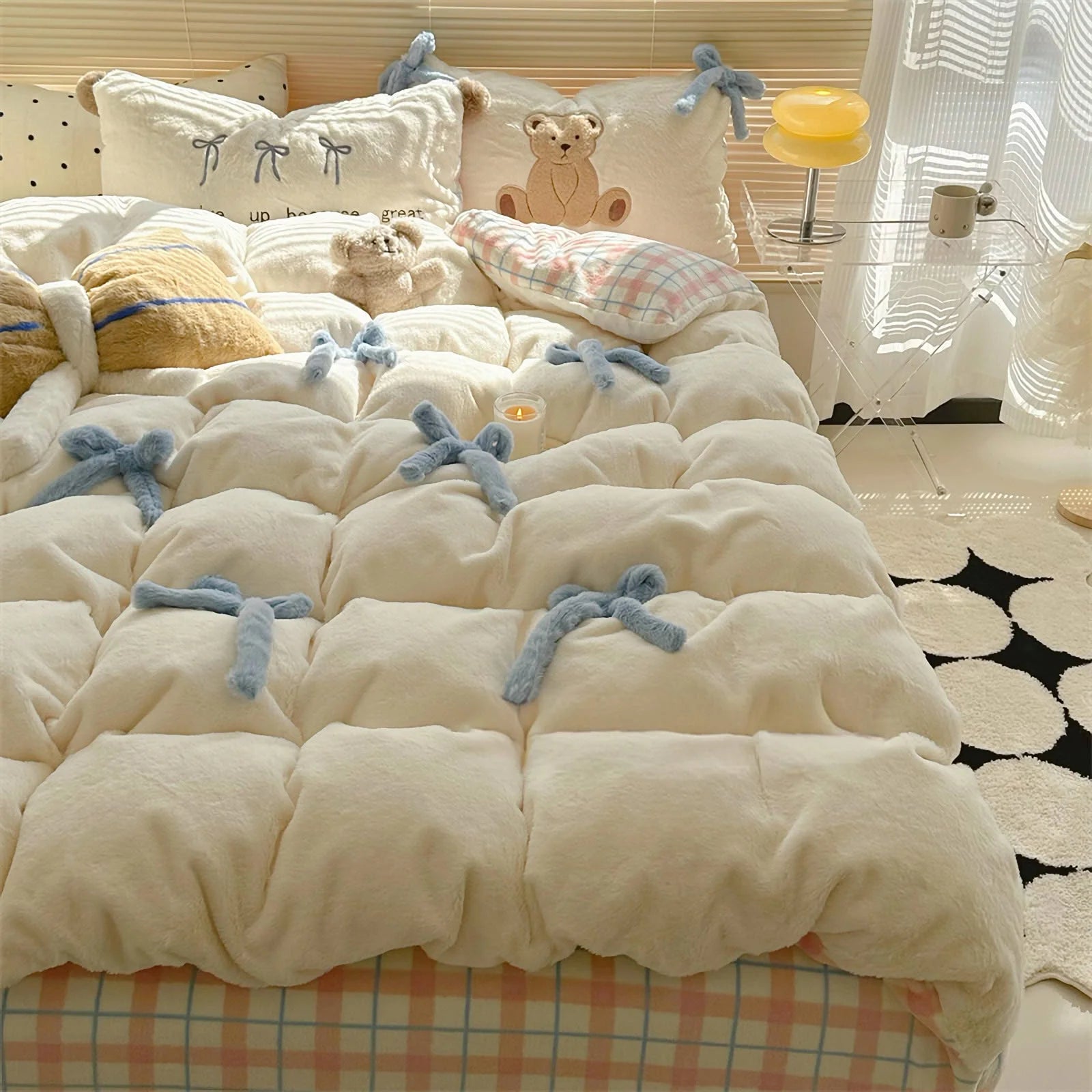 Lifestyle shot of the Creamy White Bear bedding, showing the blue bowknots and plaid sheet.