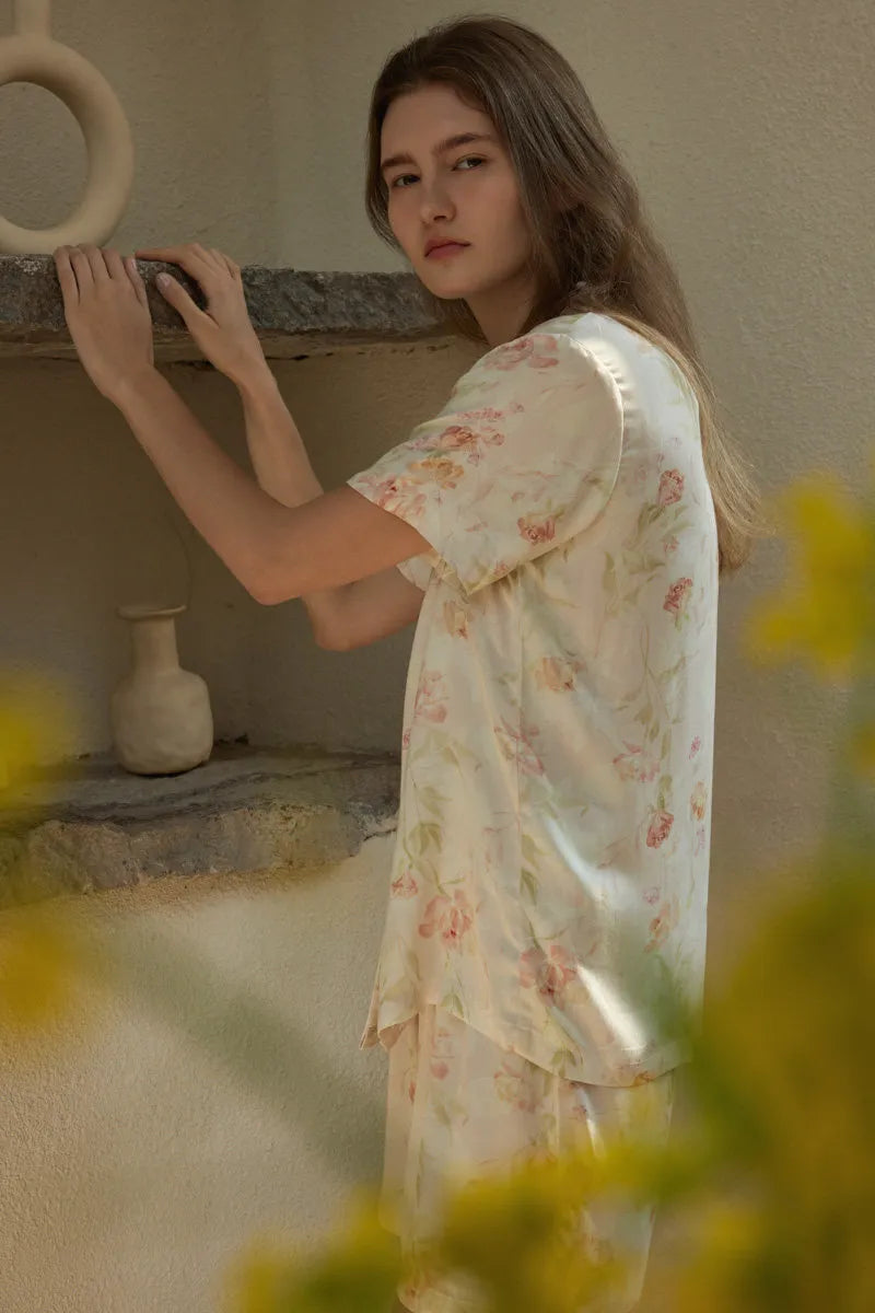 RoomDen Cream Floral Summer Pajamas - Side profile leaning against stone shelf