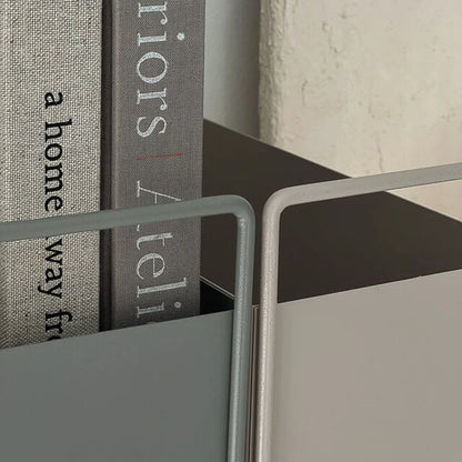 Detail shot showing the smooth, curved handles of the slate grey and warm beige minimalist organizers. - RoomDen