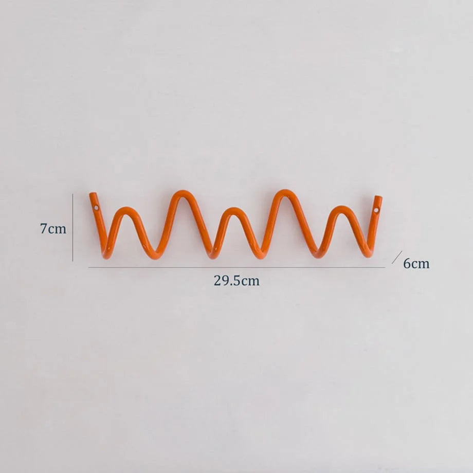 Image showing the dimensions of the M size Wavy Coil Metal Wall Hook: 29.5cm length and 7cm height. - RoomDen