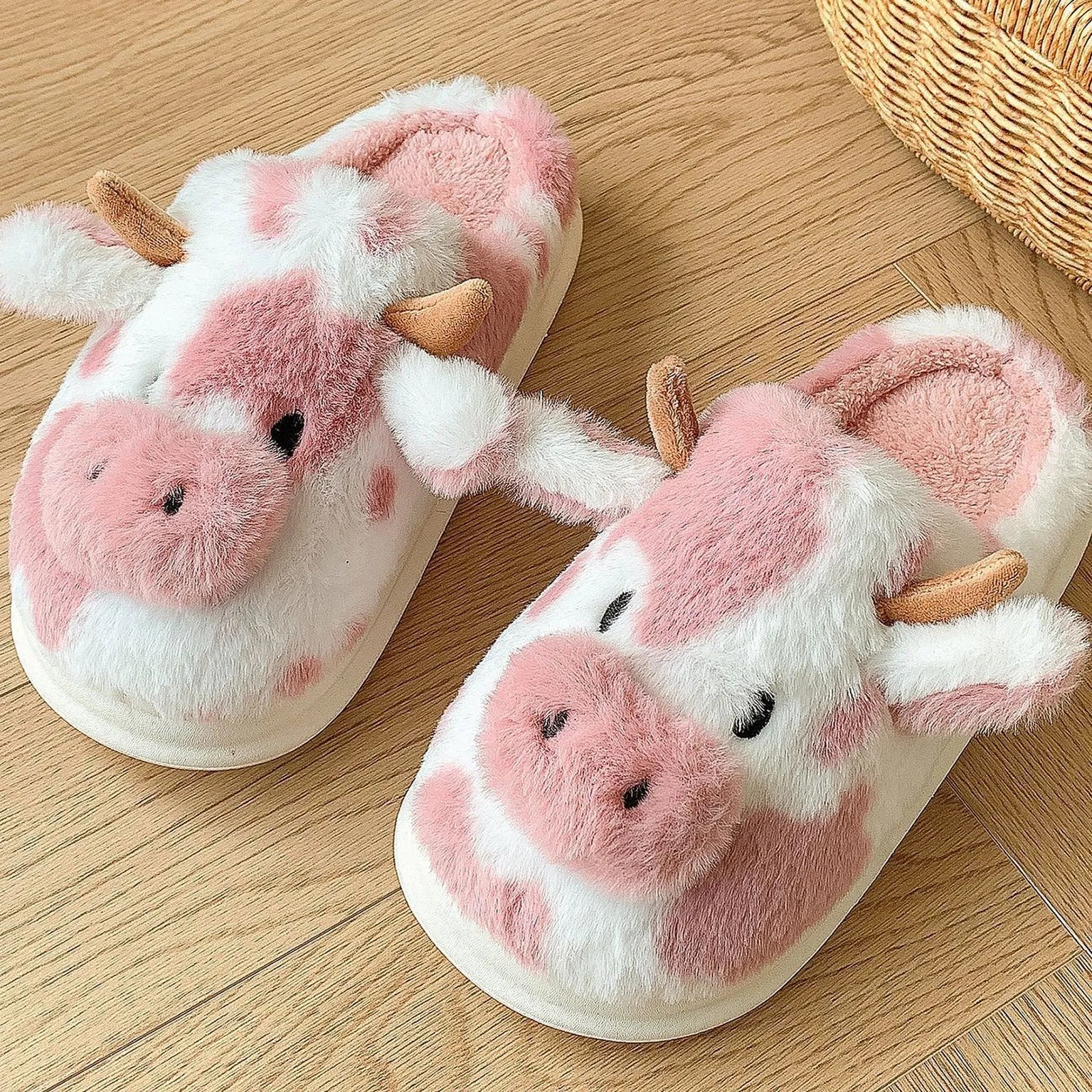 Close-up detail of Pink and White Cow Print slipper showing cute embroidered eyes and soft ears - RoomDen.