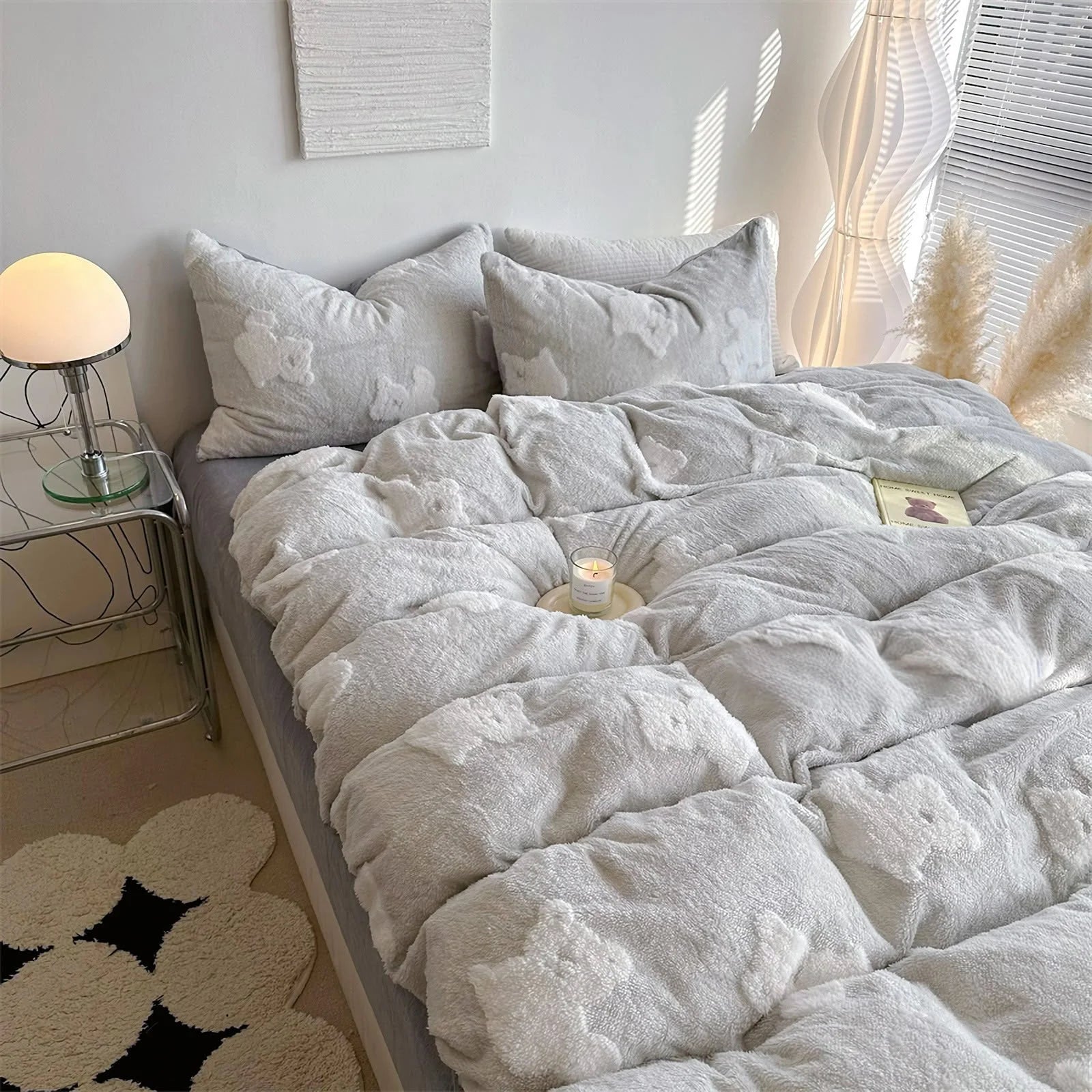 The light grey teddy bear bedding set on a bed in a minimalist bedroom setting. - RoomDen