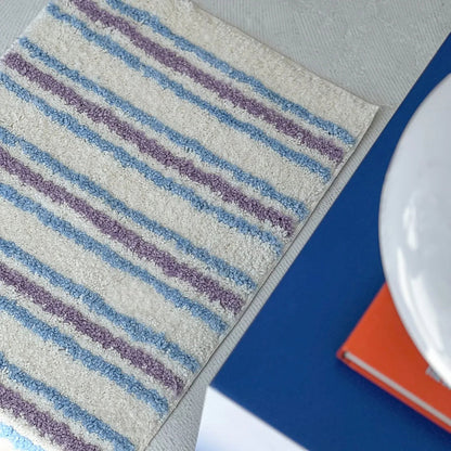 Detail View of Rug Edge and Wavy Pattern - RoomDen