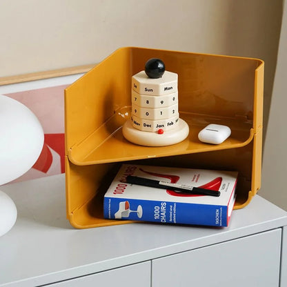 The beige perpetual desk calendar displayed on a mustard yellow tiered desk organizer. - RoomDen
