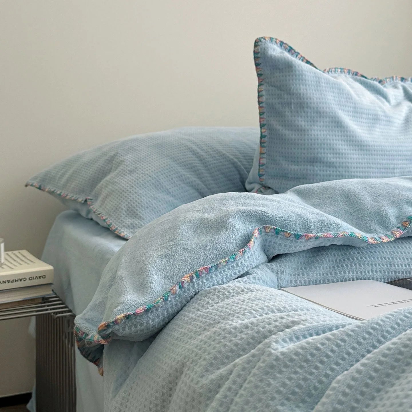 Detail shot of the colorful crochet trim and soft texture on the Sky Blue duvet cover.