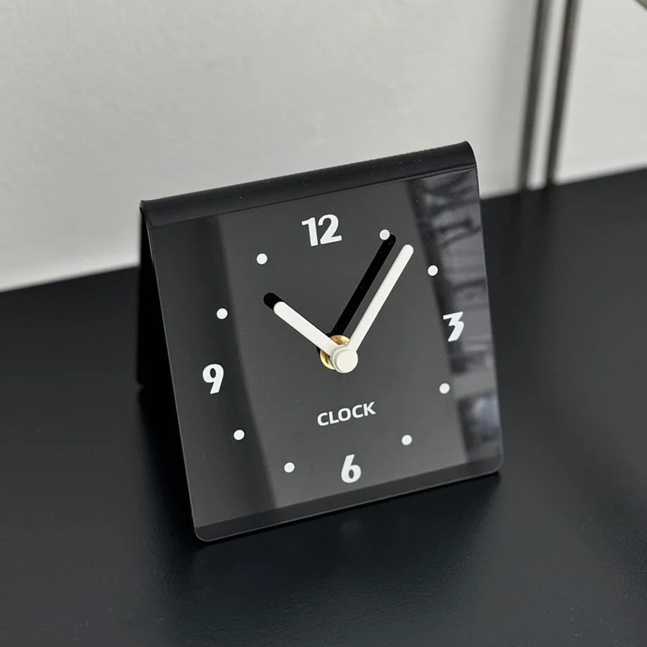 Detailed angled view of the glossy black minimalist table clock. - RoomDen