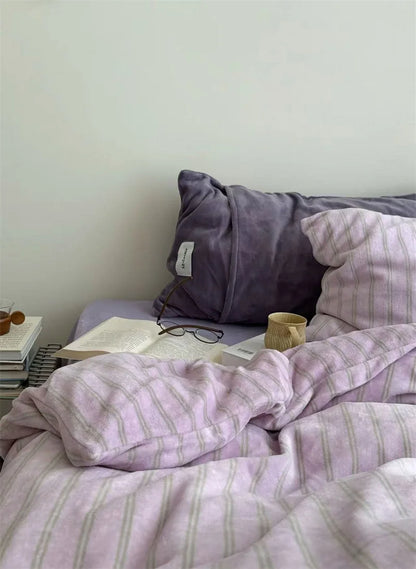 Cozy Purple Plush Bedding Scene with Mug and Book