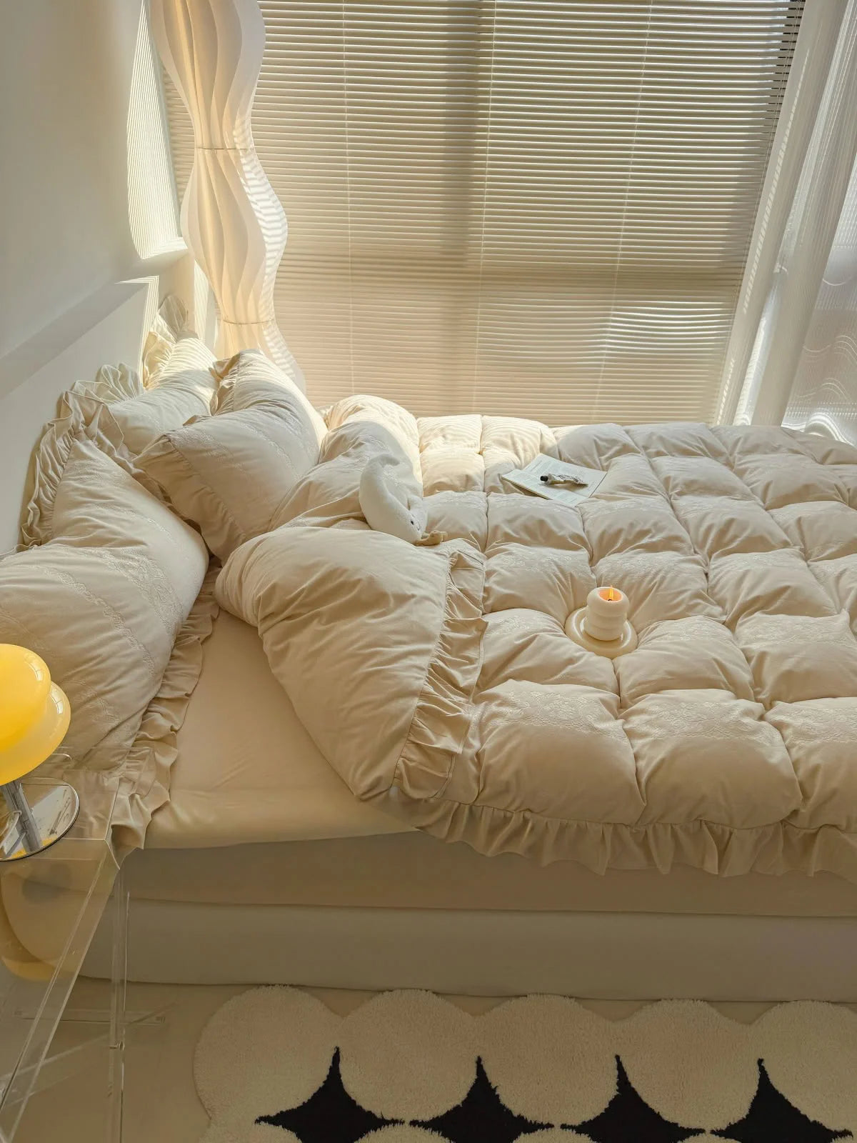 The Creamy Beige Velvet Bedding Set bathed in natural light from a window with blinds. - RoomDen