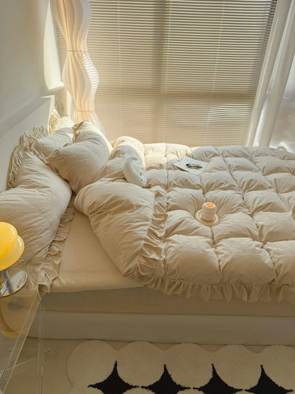 The Creamy Beige Velvet Bedding Set bathed in natural light from a window with blinds. - RoomDen