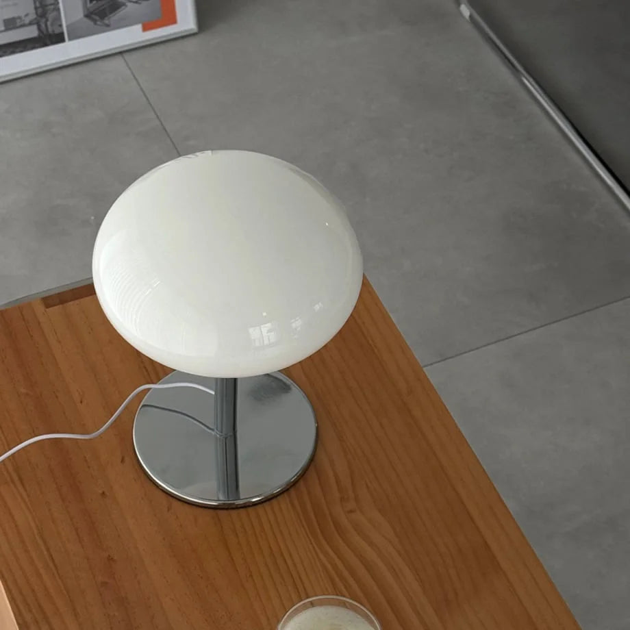 Top-down view of the glossy white dome shade of the mushroom lamp - RoomDen.