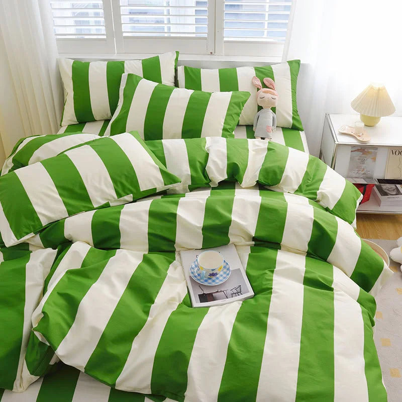 Green & White Striped Bedding Set on a bed, styled with a plush toy and a teacup on a book - RoomDen