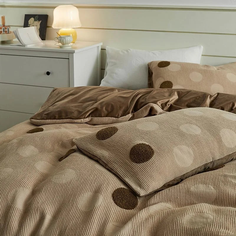 Angled view of the Mocha Polka Dot bedding, highlighting the plush texture of the flannel fleece. - RoomDen