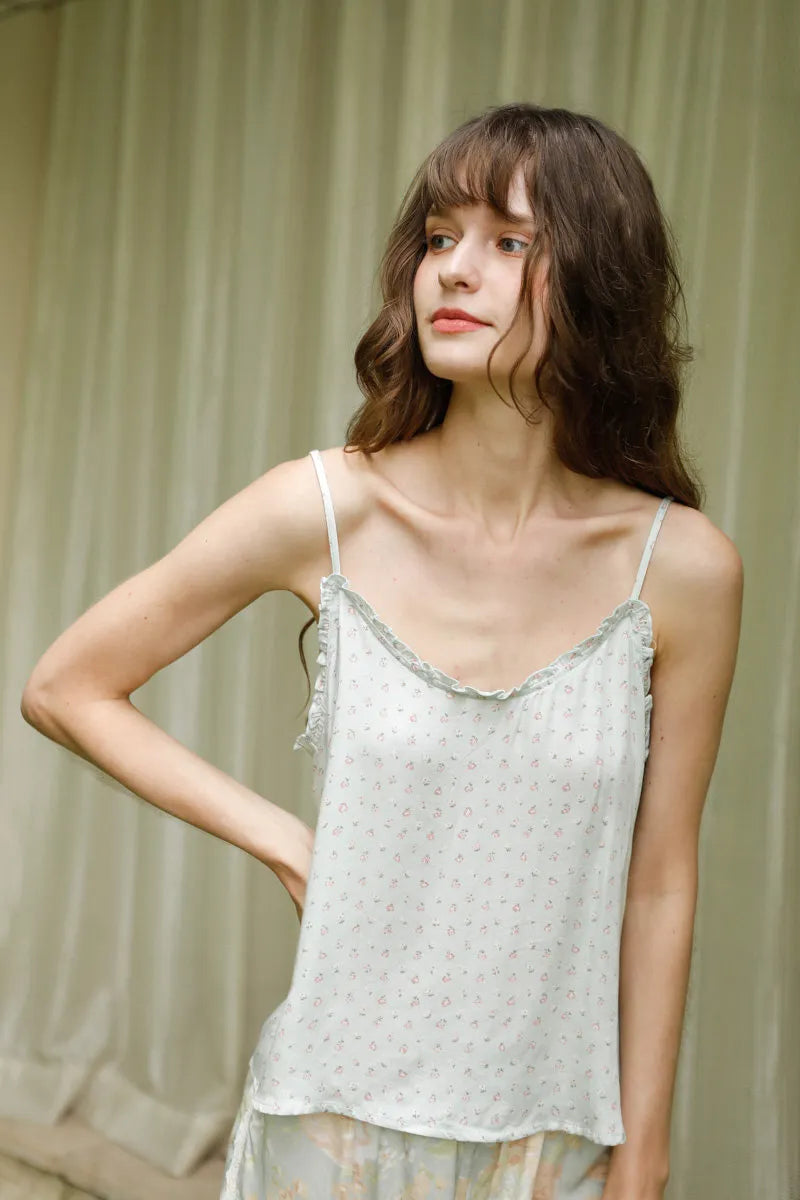 Model wearing Sage Green Cotton Sateen Pajama Set posing indoors - RoomDen