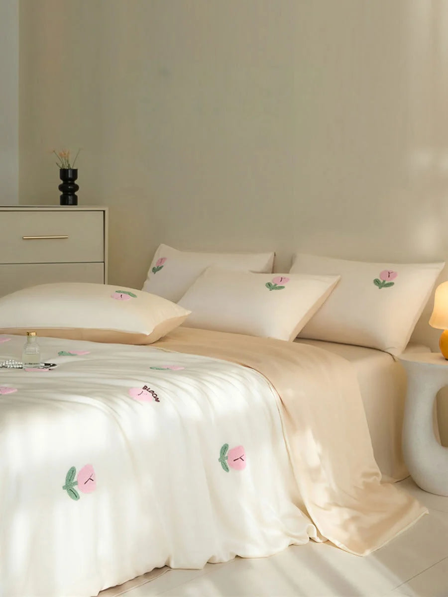The Cream & Pink Tencel bedding set styled in a bright, modern bedroom setting. - RoomDen