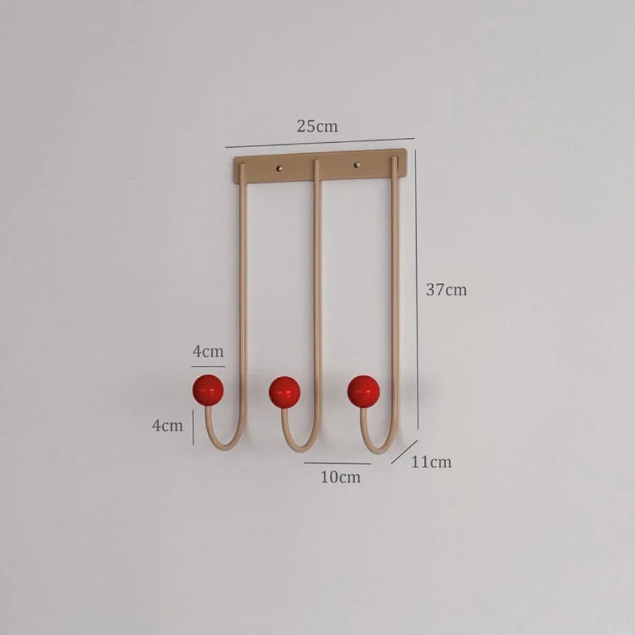 A diagram showing the dimensions of the metal wall hooks: 37cm height and 25cm width. - RoomDen