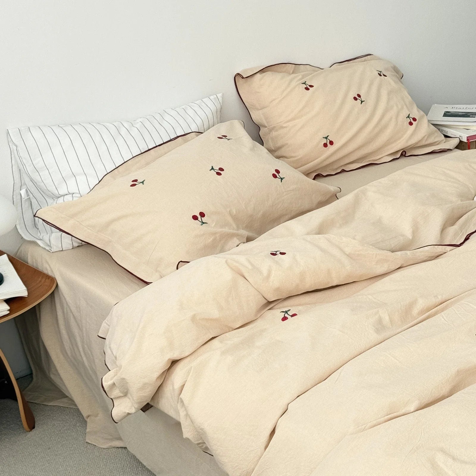Soft Embroidered Cherry Washed Cotton Bedding Set in creamy beige on a neatly made bed. - RoomDen