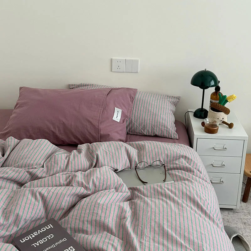 Full view of the Pink & Green Striped bedding, showing a comfortable and stylish bedroom setup - RoomDen.