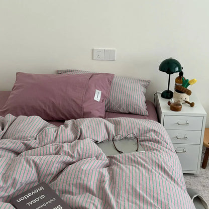 Full view of the Pink & Green Striped bedding, showing a comfortable and stylish bedroom setup - RoomDen.