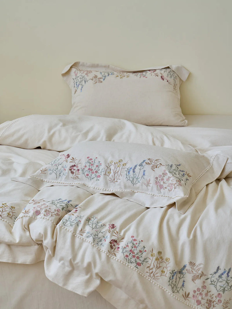 Styled bed with the Wildflower Embroidered Linen duvet and pillowcases in a romantic cottagecore mood — RoomDen