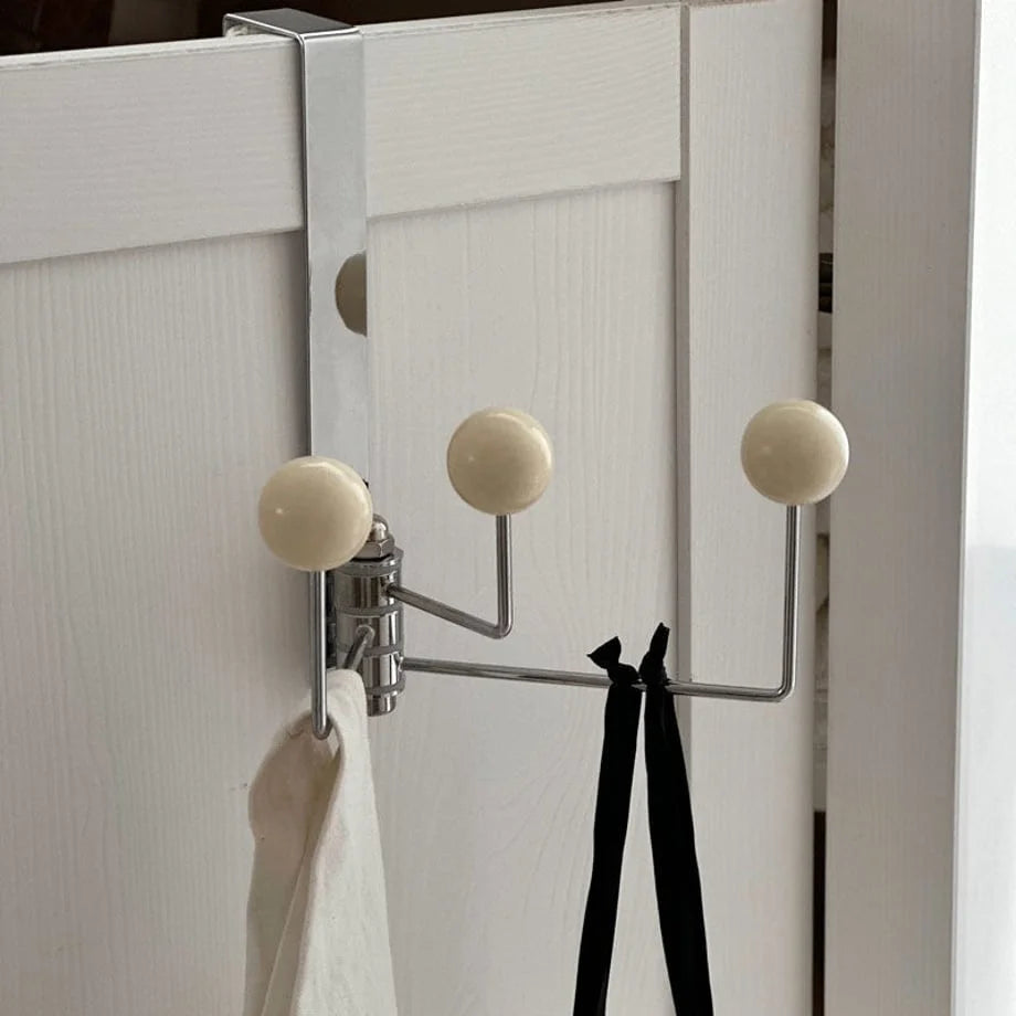 Angled view of the beige door hook, highlighting its clean lines and minimalist aesthetic - RoomDen