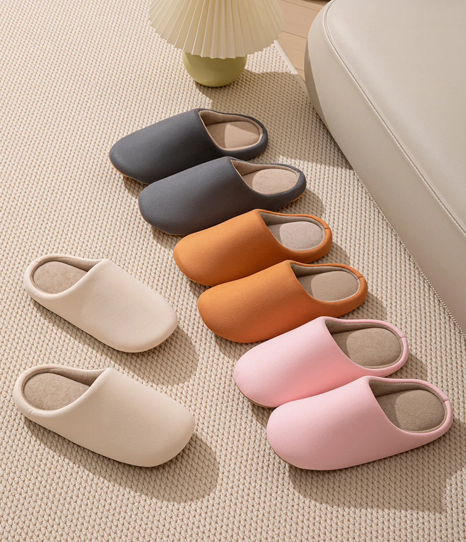Collection of plush house slippers in grey orange beige and pink - RoomDen