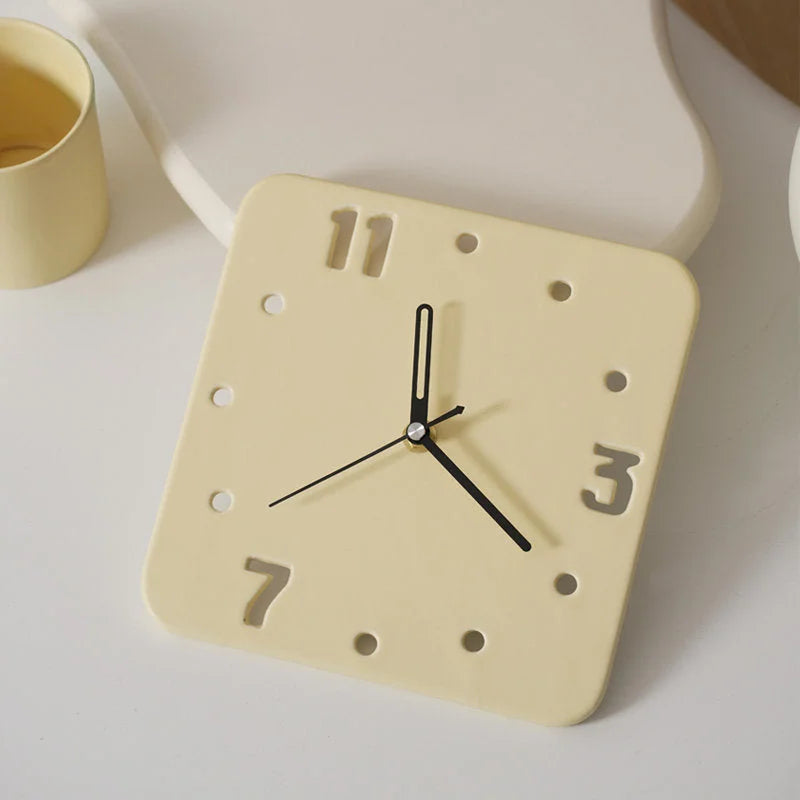 Angled view of the Butter Yellow Minimalist Cutout Ceramic Table Clock - RoomDen.
