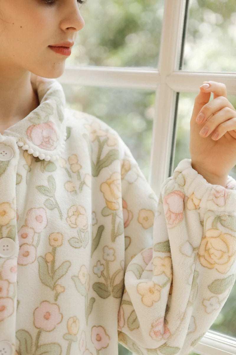 Detail shot of pom-pom trim on collar and soft fleece texture - RoomDen