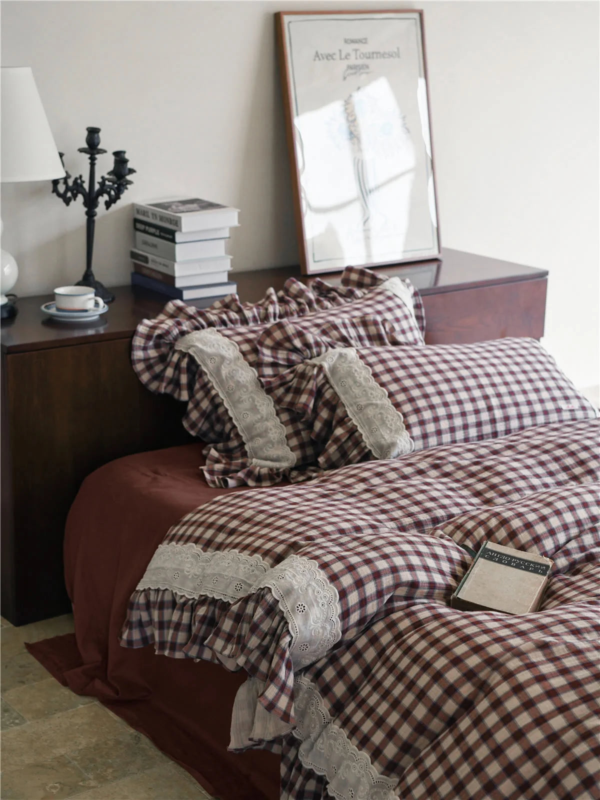 Brown Gingham Bedding Set styled on a bed next to a dark wood nightstand with books and a lamp.