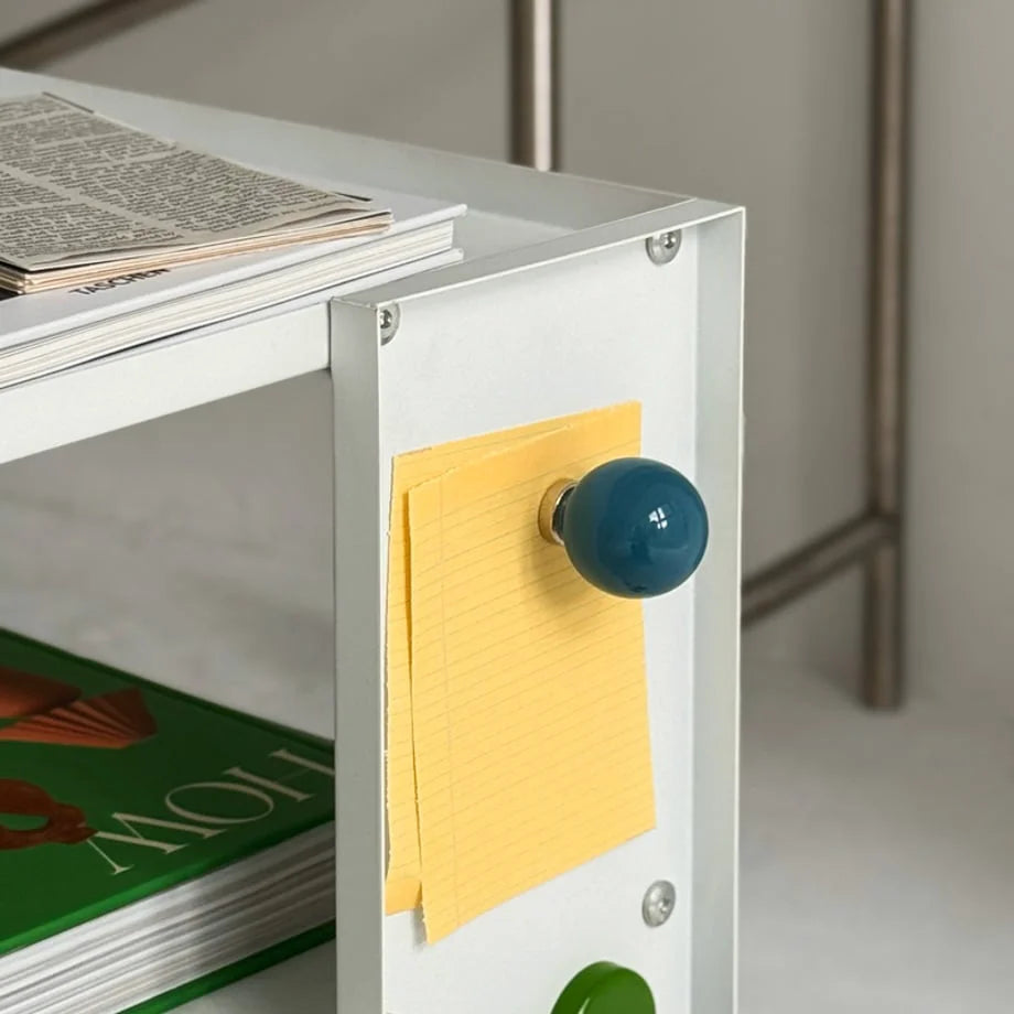 Detail shot of a Blue Smooth Ball-Shaped Magnetic Hook holding yellow sticky notes. - RoomDen