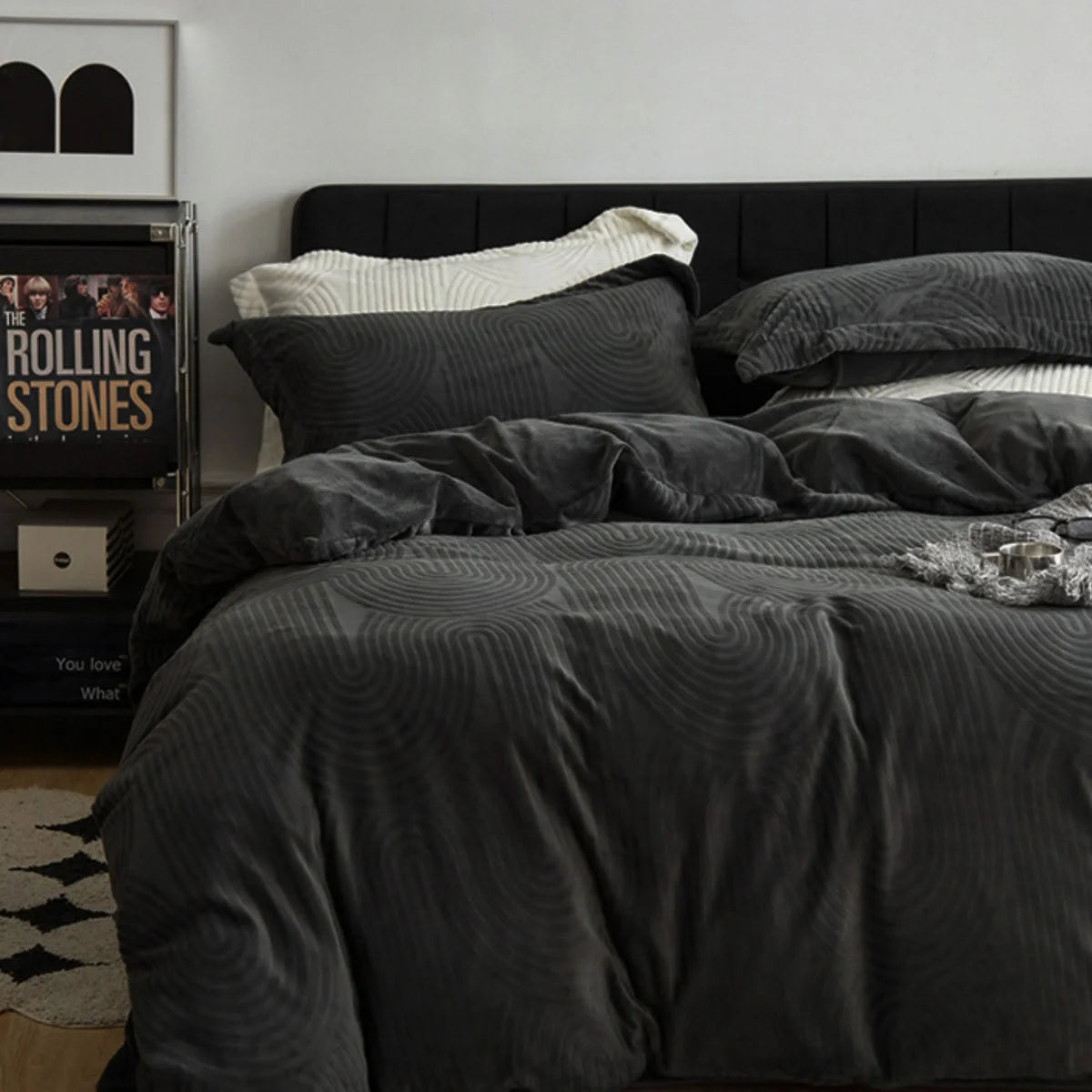 Full view of a bed made with the Charcoal Grey Plush Wavy Arch Flannel Fleece Bedding Set for a moody, modern look.