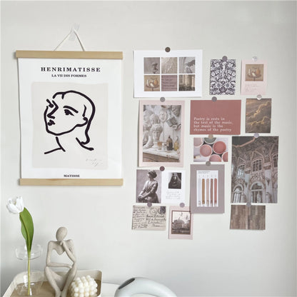 Light Academia wall collage kit displayed next to a framed Matisse print, showing a styled study area - RoomDen.