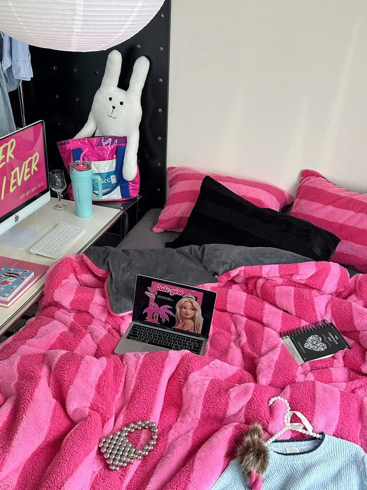 Bright pink fuzzy striped duvet cover in a gamer girl bedroom setup - RoomDen