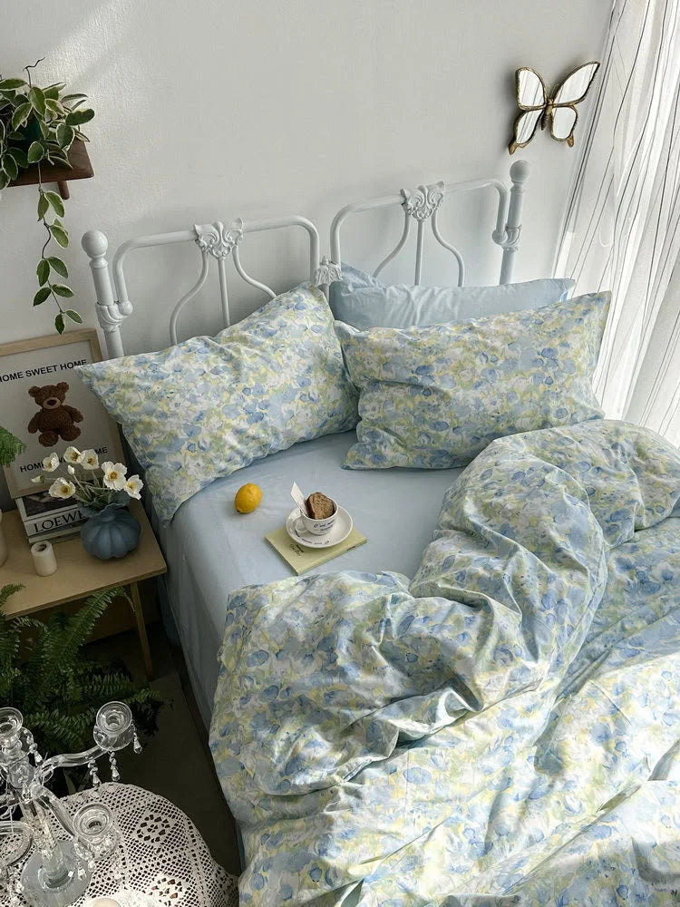 Overhead view of the watercolor floral bedding set, showing the soft texture of the washed cotton duvet cover.